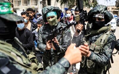 Fighters with the Izz-Al Din Al-Qassam Brigades, the armed wing of the Hamas movement, in Nuseirat refugee camp in the central Gaza Strip, on April 18, 2021. (Mahmud Hams/AFP)