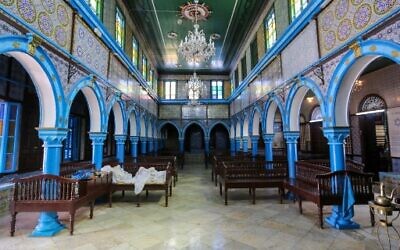 A picture taken on April 26, 2021 shows a internal view of the Ghriba Synagogue, the oldest Jewish monument built in Africa on the first day of the annual pilgrimage, in the Mediterranean Tunisian resort island of Djerba.(Photo by FATHI NASRI / AFP)