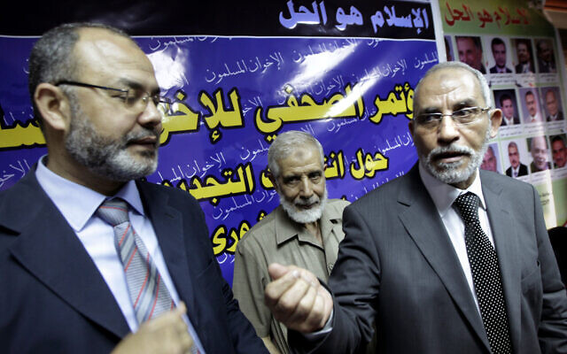 Mahmoud Ezzat, a top Muslim Brotherhood leader, left, and Mohammed Badie, leader of Muslim Brotherhood leave a press conference in Cairo, Egypt, on May 5, 2010. (AP Photo/Amr Nabil, File)