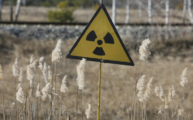 A radiation sign outside the deserted town of Pripyat, some 3 kilometers (1.86 miles) from the Chernobyl nuclear power plant in Ukraine, February 4, 2020. (AP Photo/Efrem Lukatsky)
