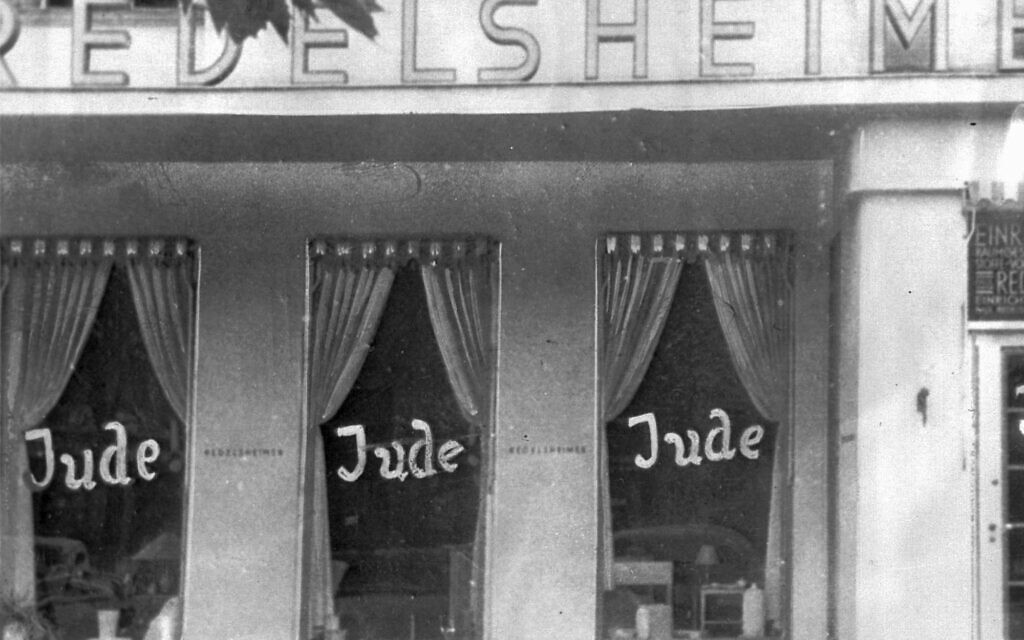 FILE -  In this June 19, 1938 file picture, the word Jude (Jew) is smeared on the windows of a shop in Berlin run by Jews.  (AP Photo)