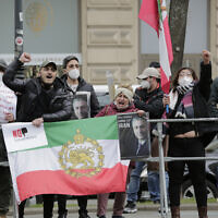 Demonstrators of an Iranian opposition group protest near the 'Grand Hotel Wien' where closed-door nuclear talks with Iran take place in Vienna, Austria on April 15, 2021. (AP Photo/Lisa Leutner)