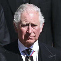 Britain's Prince Charles sheds a tear as he follows the coffin as it makes its way past the Round Tower during the funeral of Britain's Prince Philip, inside Windsor Castle in Windsor, England, April 17, 2021. (Leon Neal/Pool via AP/ File)