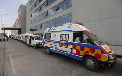 Ambulances carrying COVID-19 patients queue up waiting for their turn to be attended at a dedicated COVID-19 government hospital in Ahmedabad, India, April 17, 2021. (Ajit Solanki/AP)