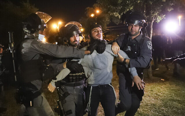Israeli border police detain an Israeli youth as members of "Lahava", a Jewish extremist group, as they try approach to Damascus Gate to protest amid heightened tensions in the city, just outside Jerusalem's Old City, Thursday, April. 22, 2021. (AP Photo/Ariel Schalit)