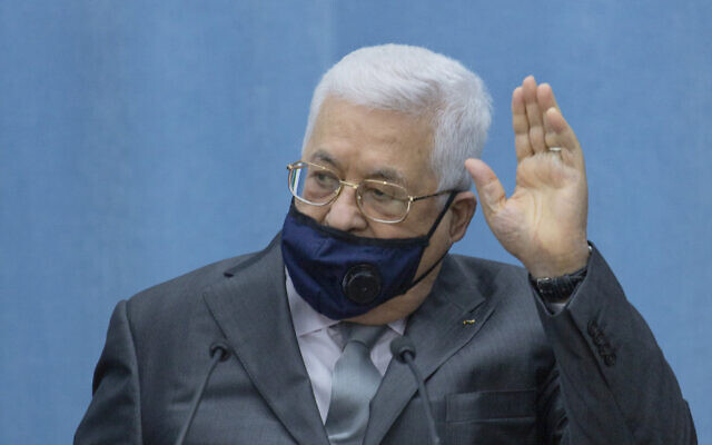 Palestinian President Mahmoud Abbas wears a mask upon his arriving to head the Palestinian leadership meeting at his headquarters, in the West Bank city of Ramallah, May 7, 2020. (AP Photo/Nasser Nasser, Pool)