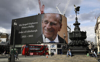 A tribute to Britain's Prince Philip is projected onto a large screen at Piccadilly Circus in London, Friday, April 9, 2021 (AP Photo/Matt Dunham)