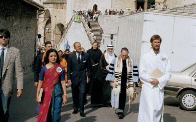 Prince Philip, the Duke of Edinburgh, president of the World Wildlife Fund, center, leads a procession with representatives of various religions from the convent to St. Francis's Basilica during an interfaith ceremony marking the end of the WWF 25th Anniversary Conference in Assisi, Italy, Sept. 29, 1986. (Giulio Broglio/AP)