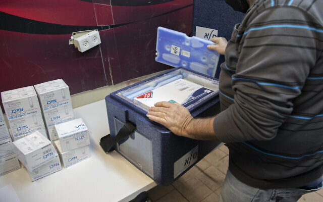 Pfizer-BioNTech's COVID-19 vaccines arrive at a Clalit vaccination center in Jerusalem, on January 4, 2021. (Olivier Fitoussi/ Flash90)