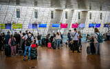 Travelers at the departures hall in Ben Gurion Airport on April 18, 2021. (Yossi Aloni/Flash90)