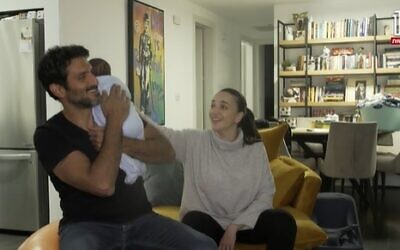 Lucy Aharish, Tsahi Halevy and their baby (screen capture: Channel 12)