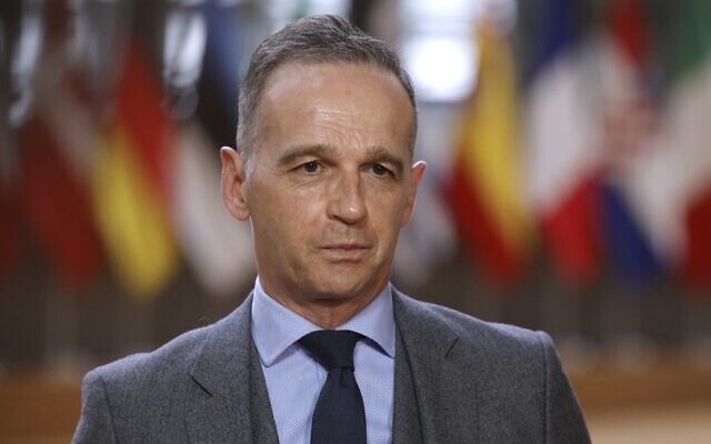 German Foreign Minister Heiko Maas speaks with the media upon his arrival for a meeting with EU foreign affairs ministers at the European Council building, in Brussels, on May 10, 2021. (Olivier Matthys/Pool/AFP)