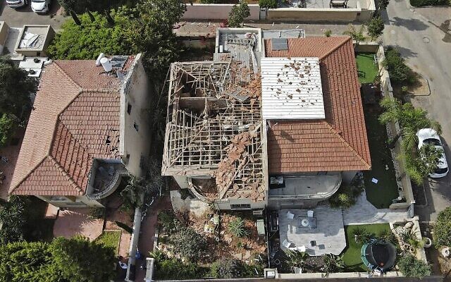 An overhead view of an Ashkelon home badly damaged by a rocket fired from Gaza on May 11, 2021. A man was seriously hurt in the attack. (JACK GUEZ / AFP)