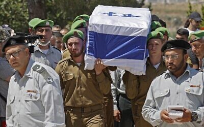 Mourners attend the funeral of Israeli soldier Omer Tabib, 21, in Elyakim in northern Israel, on May 13, 2021. Tabib was killed when Palestinian terrorists in Gaza fired an anti-tank missile near the border. (JACK GUEZ / AFP)