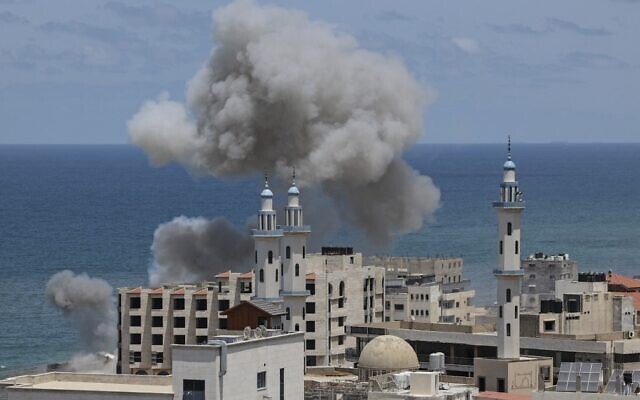 Smoke billows from the the area around the port of Gaza City following an Israeli bombardment from the Mediterranean Sea on May 17, 2021, amid fighting between the Israel Defense Forces and Gaza-ruling Hamas terror group. (Mahmud Hams/AFP)