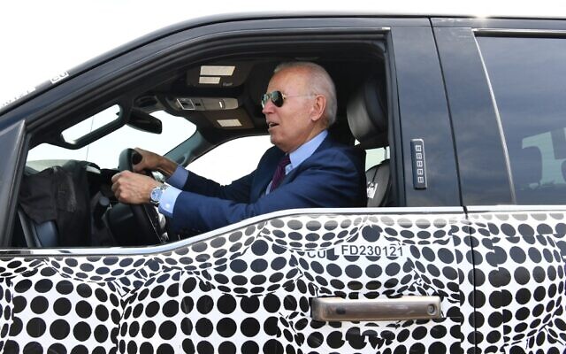 US President Joe Biden drives the new electric Ford F-150 Lightning at the Ford Dearborn Development Center in Dearborn, Michigan on May 18, 2021. (Nicholas Kamm / AFP)