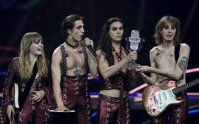 Italy's Maneskin celebrate on stage with the trophy after winning the final of the 65th edition of the Eurovision Song Contest 2021, at the Ahoy convention center in Rotterdam, on May 22, 2021. (Kenzo Tribouillard / AFP)