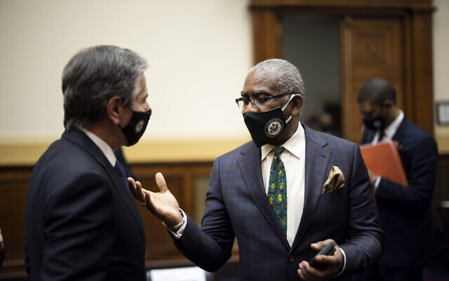 Secretary of State Antony Blinken talks with Rep. Gregory Meeks, D-N.Y., after a House Committee on Foreign Affairs hearing on the administration foreign policy priorities on Capitol Hill on Wednesday, March 10, 2021, in Washington. (Ting Shen/Pool via AP)