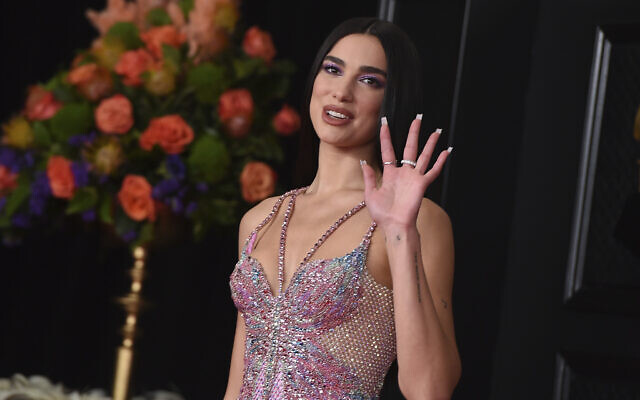 Dua Lipa arrives at the 63rd annual Grammy Awards at the Los Angeles Convention Center, March 14, 2021. (Photo by Jordan Strauss/Invision/AP, File)