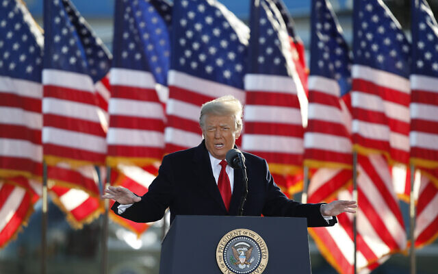 US President Donald Trump speaks to crowd before boarding Air Force One at Andrews Air Force Base, Md., January 20, 2021. (AP Photo/Luis M. Alvarez, File)