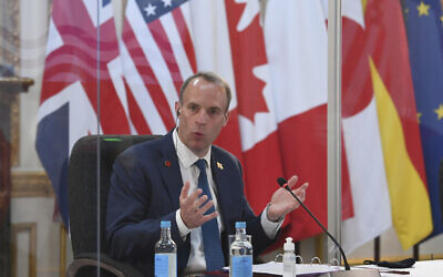 Britain's Foreign Secretary Dominic Raab addresses G7 foreign ministers while being socially distanced as they meet in London, during talks at the G7 Foreign and Development Ministers meeting, May 4, 2021. (Stefan Rousseau/Pool via AP)