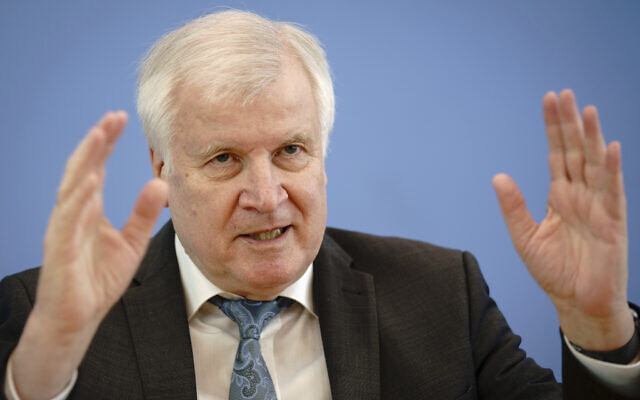 Horst Seehofer (CSU), Federal Minister of the Interior, for Construction and Home Affairs, presents the case figures of politically motivated crime for the year 2020 at the Federal Press Conference in Berlin, Germany, May 4, 2021. (Kay Nietfeld/dpa via AP)