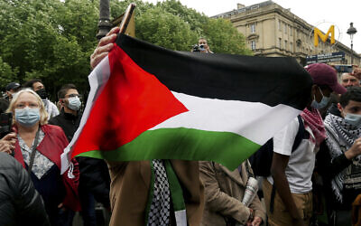 Illustrative: A protester waves a flag during a protest in solidarity with Palestinians, in Paris, Wednesday, May 12, 2021. (AP/Thibault Camus)