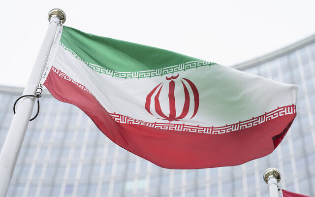 The flag of Iran is seen in front of the Headquarters of the International Atomic Energy Agency, in Vienna, Austria, May 24, 2021. (Florian Schroetter/AP)