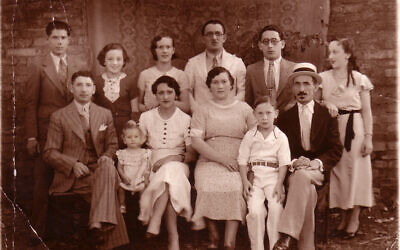 Ruth Behar's grandmother Esther (third from left in front row, in white dress) with her family in Agramonte, Cuba, c. 1936. (Courtesy)