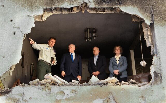 Illustrative: US Conference of Presidents leaders (from left) Malcolm Hoenlein, William Daroff and Dianne Lob visit a home in Petah Tikva hit by a rocket fired from Gaza, June 1, 2021 with IDF spokesman Jonathan Conricus (Avi Hayun)
