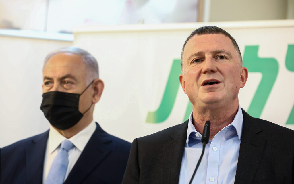 Prime Minister Benjamin Netanyahu (left) and Health Minister Yuli Edelstein, seen during a visit at the COVID-19 vaccination center in Zarzir, northern Israel, on February 9, 2021. (David Cohen/Flash90)