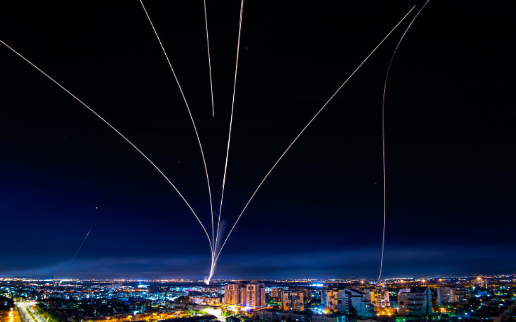 A long-exposure picture shows Iron Dome anti-missile system fire to intercept rockets launched from the Gaza Strip at Israel, as seen from the southern Israeli city of Ashdod, May 16, 2021. (Avi Roccah/Flash90)
