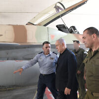 Prime Minister Benjamin Netanyahu visits the Israel Air Force base at Hatzerim, May 18, 2021. With him are Air Force chief Amikam Norkim (left) and deputy IDF chief of staff Eyal Zamir
(Kobi Gideon / GPO)
