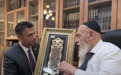 UAE envoy Mohammad Mahmoud Al Khajah, left, meets Shas party spiritual leader Rabbi Shalom Cohen in Jerusalem, May 30, 2021. (Screenshot: YouTube)