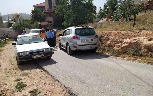 The vehicle (right) suspected of being used in a drive-by shooting attack is found in the village of Aqraba in the northern West Bank on May 3, 2021. (Social media)