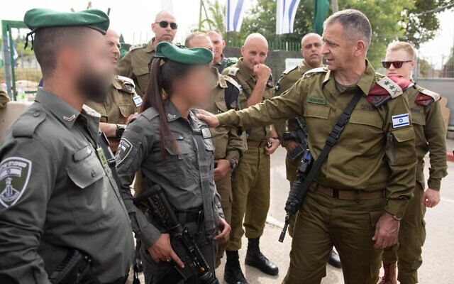 IDF Chief fo Staff Aviv Kohavi, right, meets with Border Police officers who responded to a shooting attack in the West Bank two days prior, on May 9, 2021. (Israel Defense Forces)