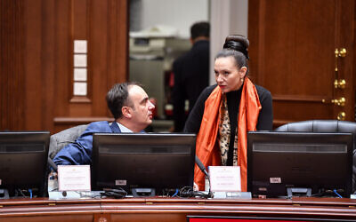 Rasela Mizrahi, right, speaks to a colleague during a cabinet meeting in Skopje, North Macedonia, January 14, 2020. (Courtesy of the Parliament of North Macedonia/ via JTA)
