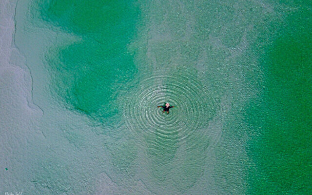 A swimmer photographed from above by Moshe Gold, whose debut photography exhibit opened June 3, 2021 at the Jerusalem Cinematheque (Courtesy Moshe Gold)