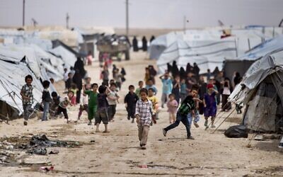 Children gather outside their tents, at al-Hol camp, which houses families of members of the Islamic State group, in Hasakeh province, Syria, May 1, 2021 (AP Photo/Baderkhan Ahmad)