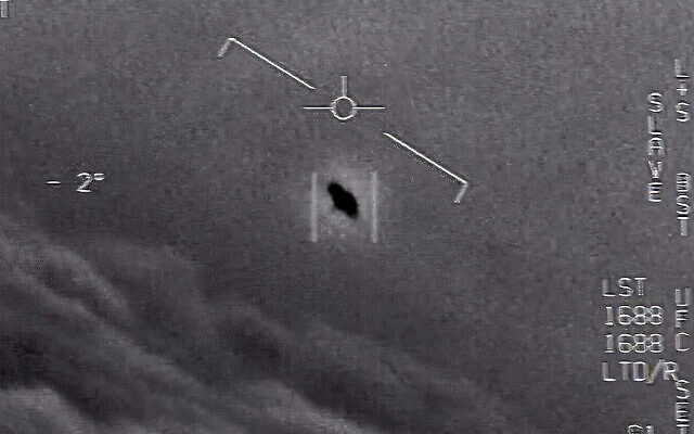 Illustrative: The image from video provided by the US Department of Defense, from 2015, shows an unexplained object as it is tracked while soaring high among the clouds, traveling against the wind. (Department of Defense via AP)