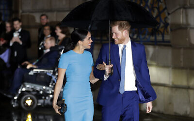 Britain's Prince Harry and Meghan, the duke and duchess of Sussex arrive at the annual Endeavour Fund Awards in London on March 5, 2020. (AP Photo/Kirsty Wigglesworth)