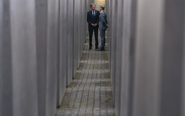 US Secretary of State Antony Blinken, left, and German Minister of Foreign Affairs Heiko Maas, right, speak together as they walk through the Memorial to the Murdered Jews of Europe following a ceremony for the launch of a U.S.-Germany Dialogue on Holocaust Issues in Berlin, June 24, 2021. (AP Photo/Andrew Harnik, Pool)