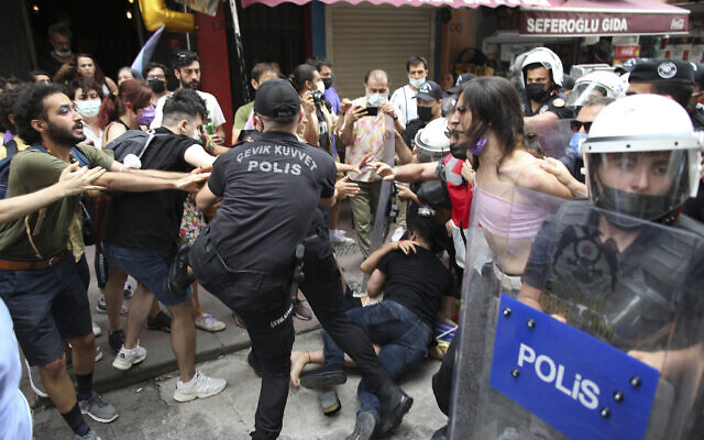 Protesters are detained by police in central Istanbul, June 26, 2021. Police used tear gas to disperse the crowds and detained dozens of LGBT activists as hundreds defied a ban and tried to stage a gay pride event. (AP Photo/Emrah Gurel)