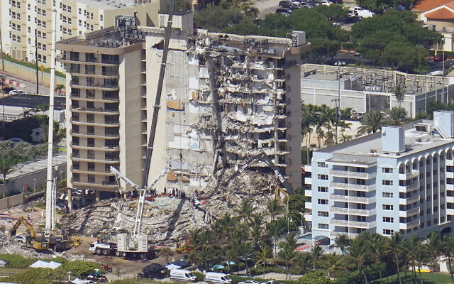 Crews work in the rubble at the Champlain Towers South Condo, Sunday, June 27, 2021, in Surfside, Fla. One hundred fifty-nine people were still unaccounted for two days after Thursday’s collapse. (AP Photo/Gerald Herbert)