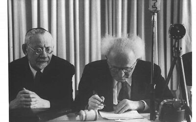 David Ben Gurion signs Israel's Declaration of Independence on November 29, 1947. (Hans Pinn/GPO)