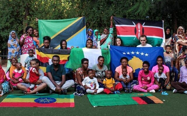 Children from Ethiopia, Tanzania, Nigeria, Kenya, Kosovo, Uganda and Zambia being treated in Holon, pose with their guardians in June 2021. (Courtesy Save a Child's Heart)