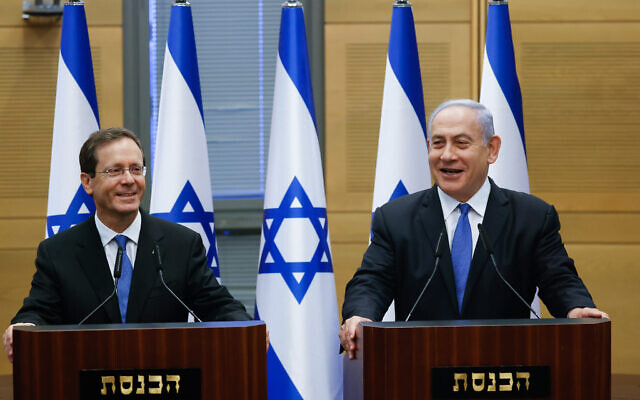 Newly elected Israeli President Isaac Herzog (left) with Prime Minister Benjamin Netanyahu in the Knesset after Herzog's election, June 2, 2021. (Yonatan Sindel/Flash90)