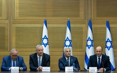 From right, Prime Minister Naftali Bennett, Foreign Minister Yair Lapid, Defense Minister Benny Gantz and Finance Minister Avigdor Liberman attend the first cabinet meeting, at the Knesset on June 13, 2021. (Yonatan Sindel/Flash90)