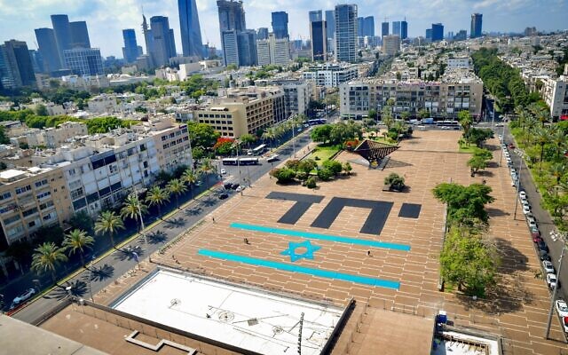 The word "Together" written largely on Rabin Square in Tel Aviv, a day after Naftali Bennett was sworn in as the new prime minister, June 14, 2021. (Avshalom Sassoni/FLASH90)
