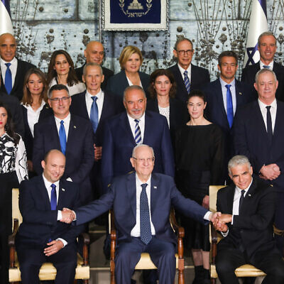 Ministers in the newly sworn in Israeli government pose for a group photo at the president's residence in Jerusalem. June 14, 2021. (Yonatan Sindel/FLASH90)